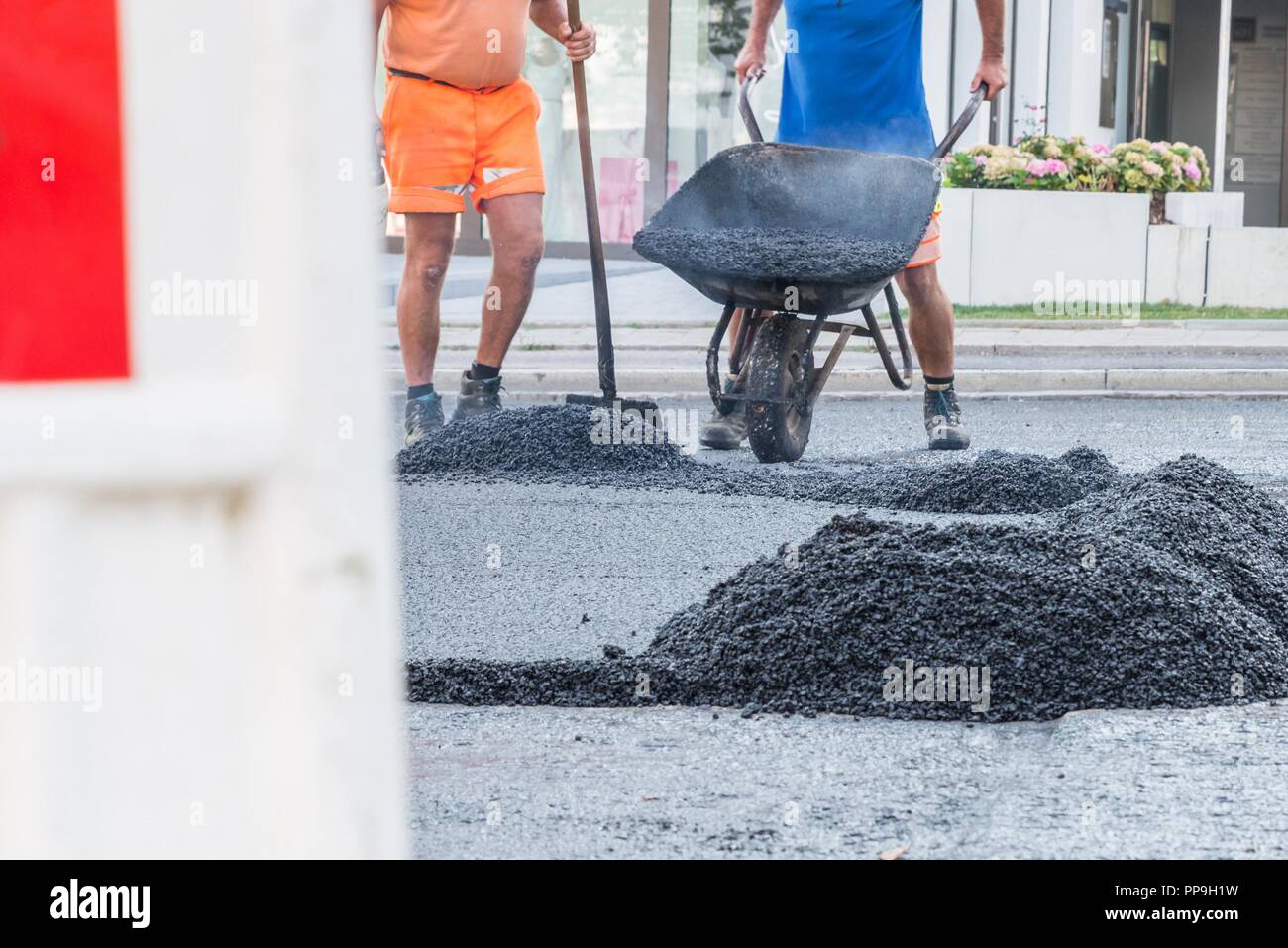 Wheelbarrows with concrete hi-res stock photography and images - Alamy
