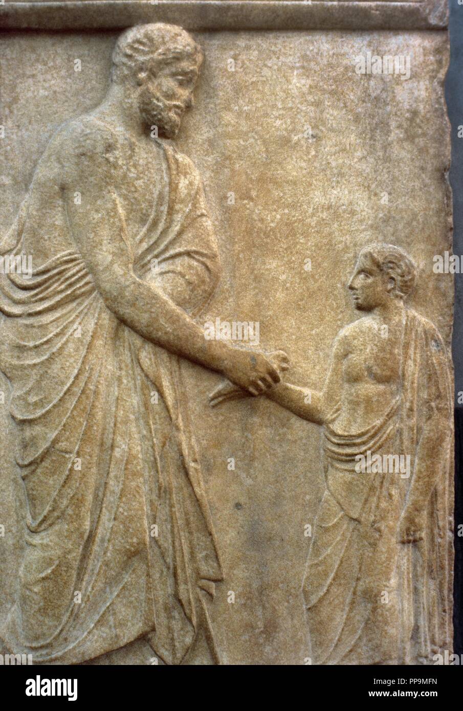 Greek Art. Classical Era. Grave stele dedicated to Philokles and his son Dikaios. A bearded man offers a bird to a young boy standing befor him. Ca. 430 B.C. Marble. It comes from Chalandri, Attica. National Archaeological Museum Athens. Greece. Stock Photo