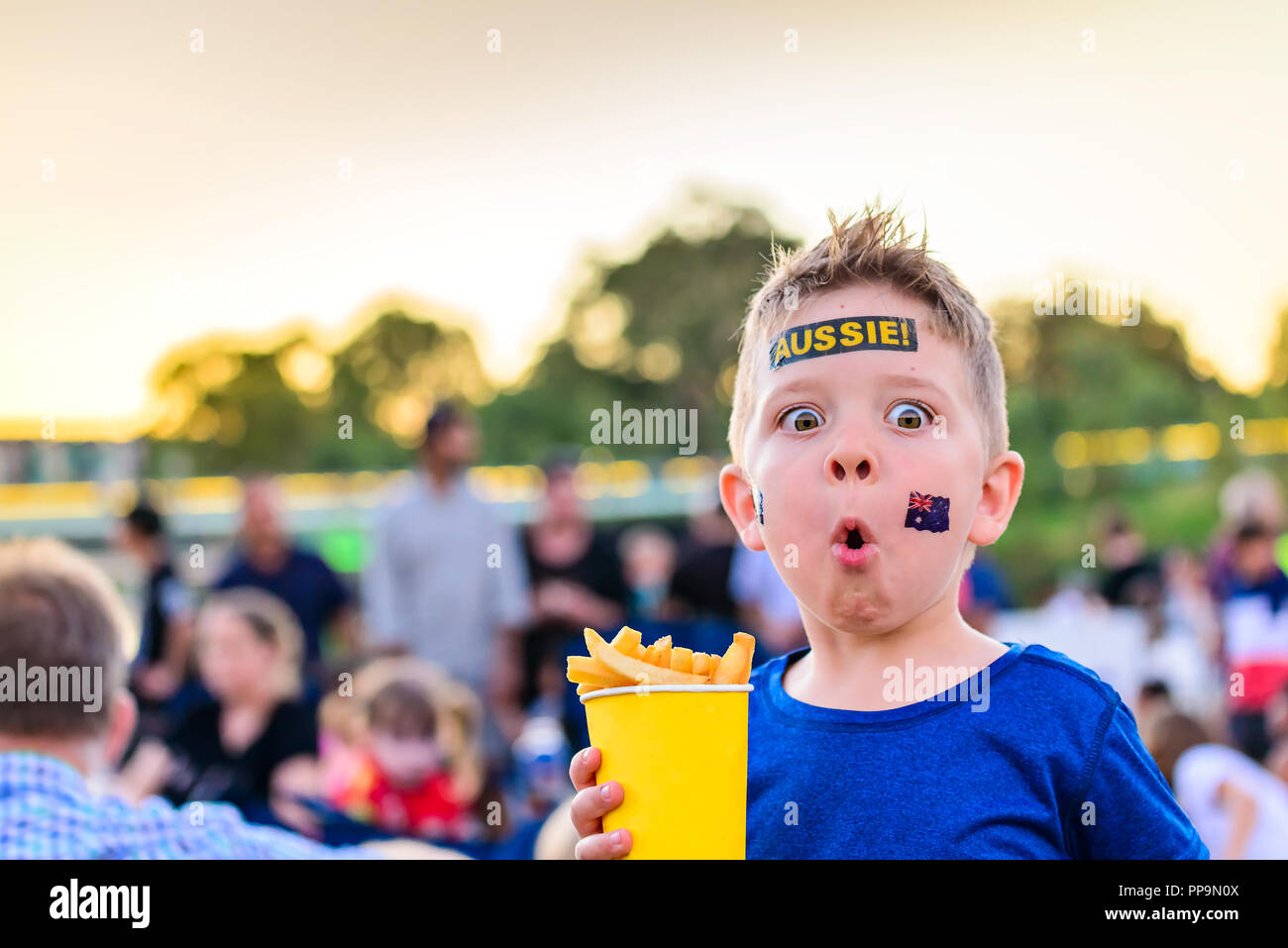 Cute Australian boy with flag tattoo on his face on Australia Day celebration in Adelaide Stock Photo