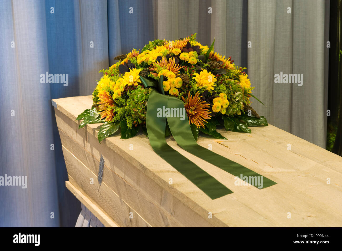 A flower arrangement on a coffin in a mortuary Stock Photo Alamy