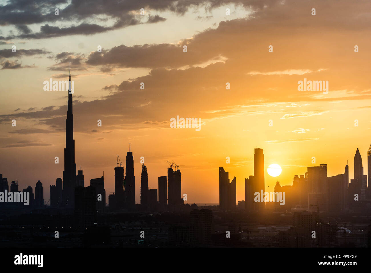 Dubai skyline at sunset Stock Photo - Alamy