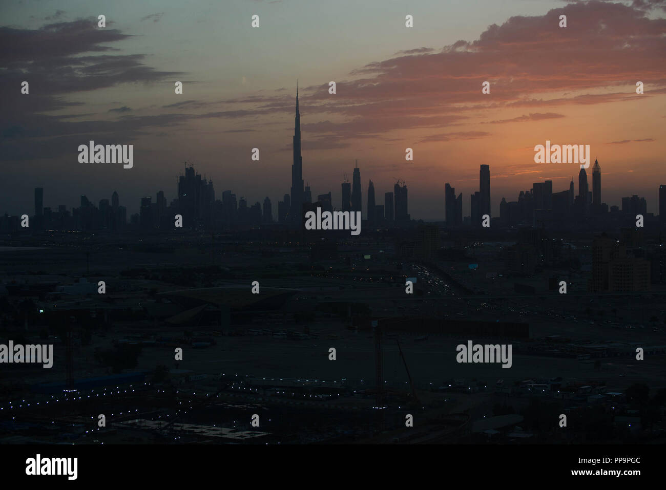 Dubai skyline at sunset Stock Photo - Alamy