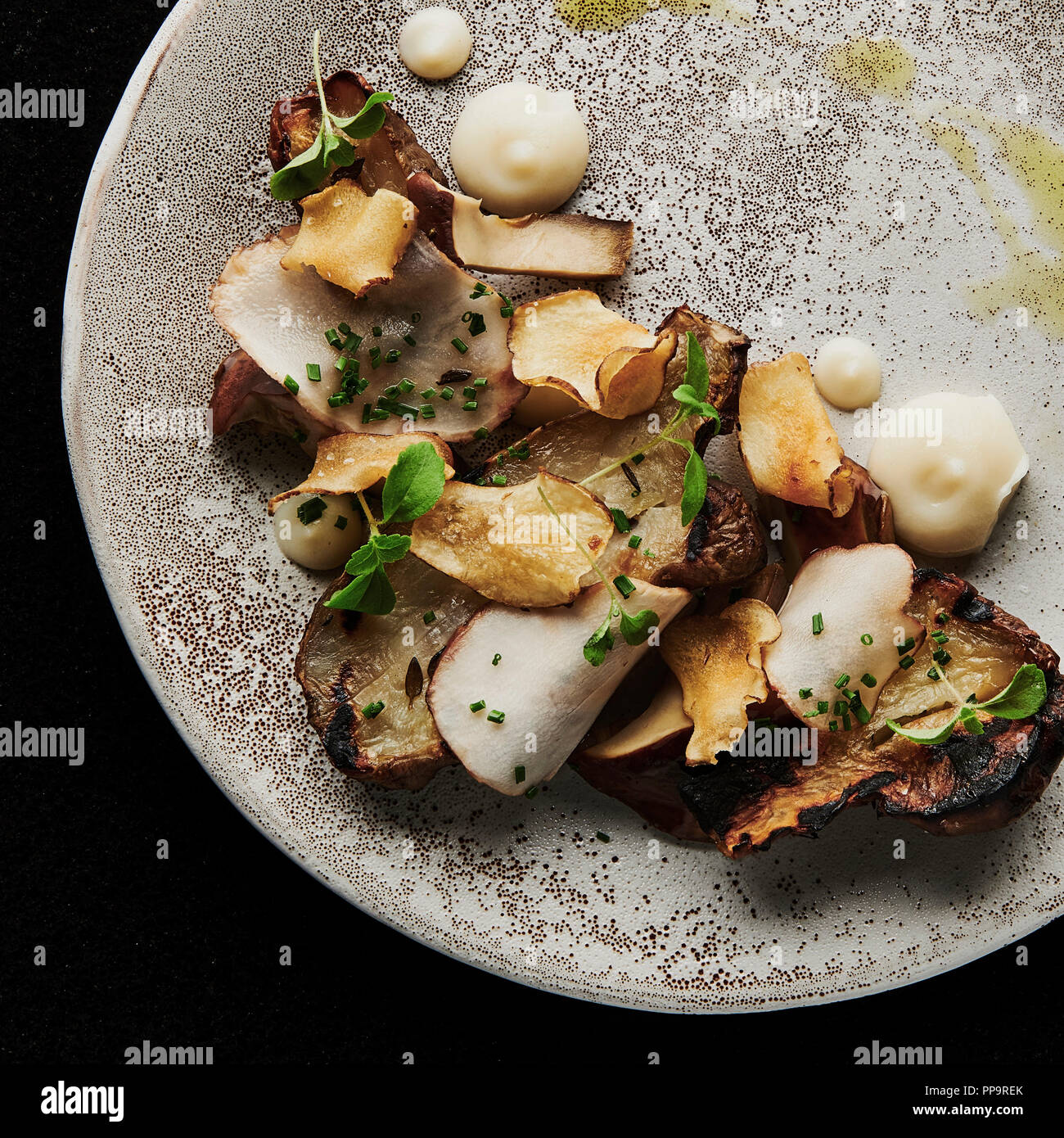 Textures of Jerusalem artichoke roasted pureed crisp grilled on white