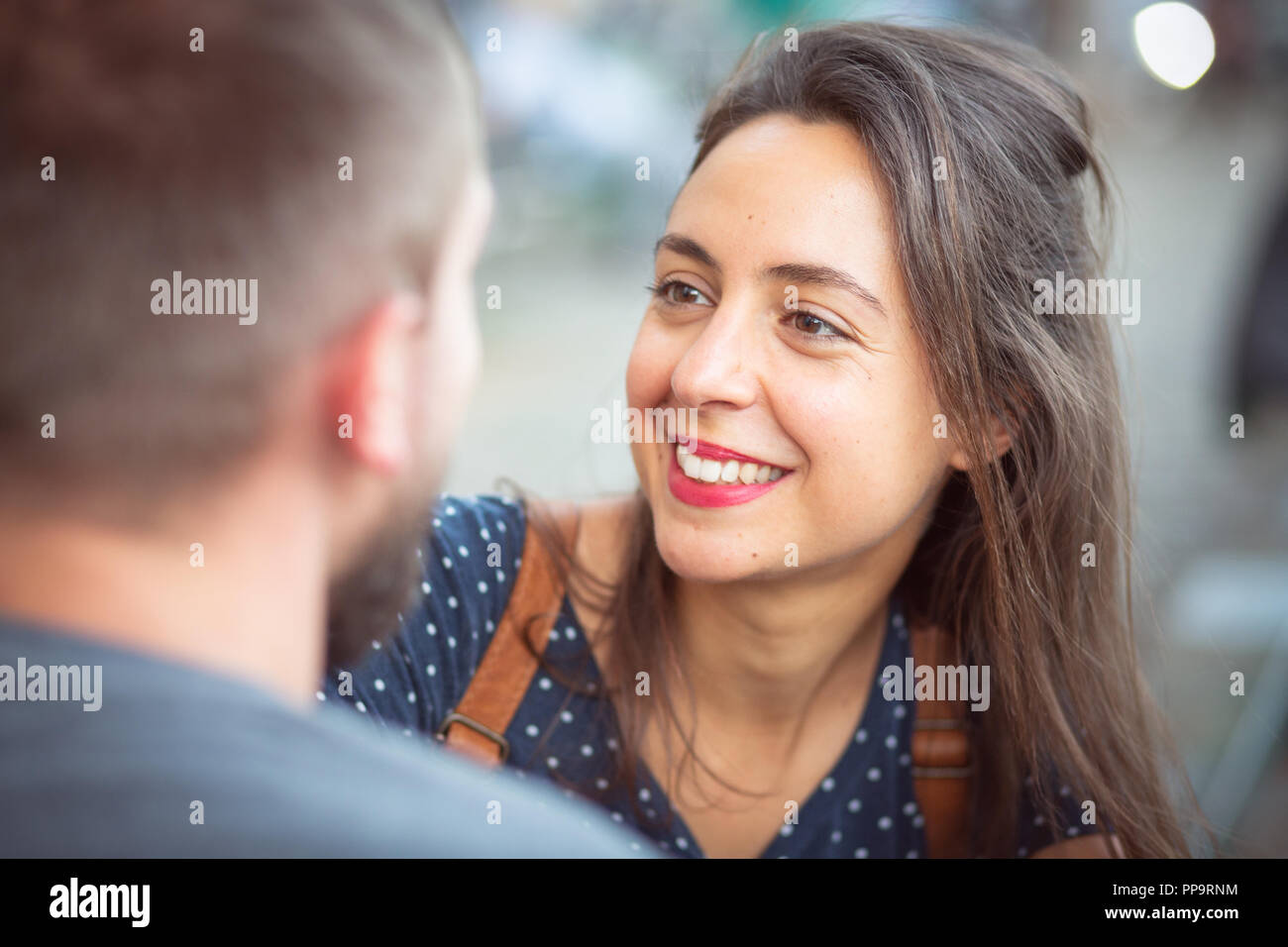Smiling woman having a conversation Stock Photo