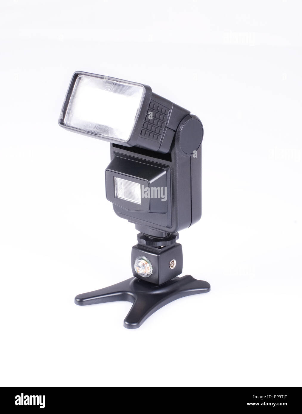 Flash for a camera on a white isolated background. Studio flash light Stock Photo