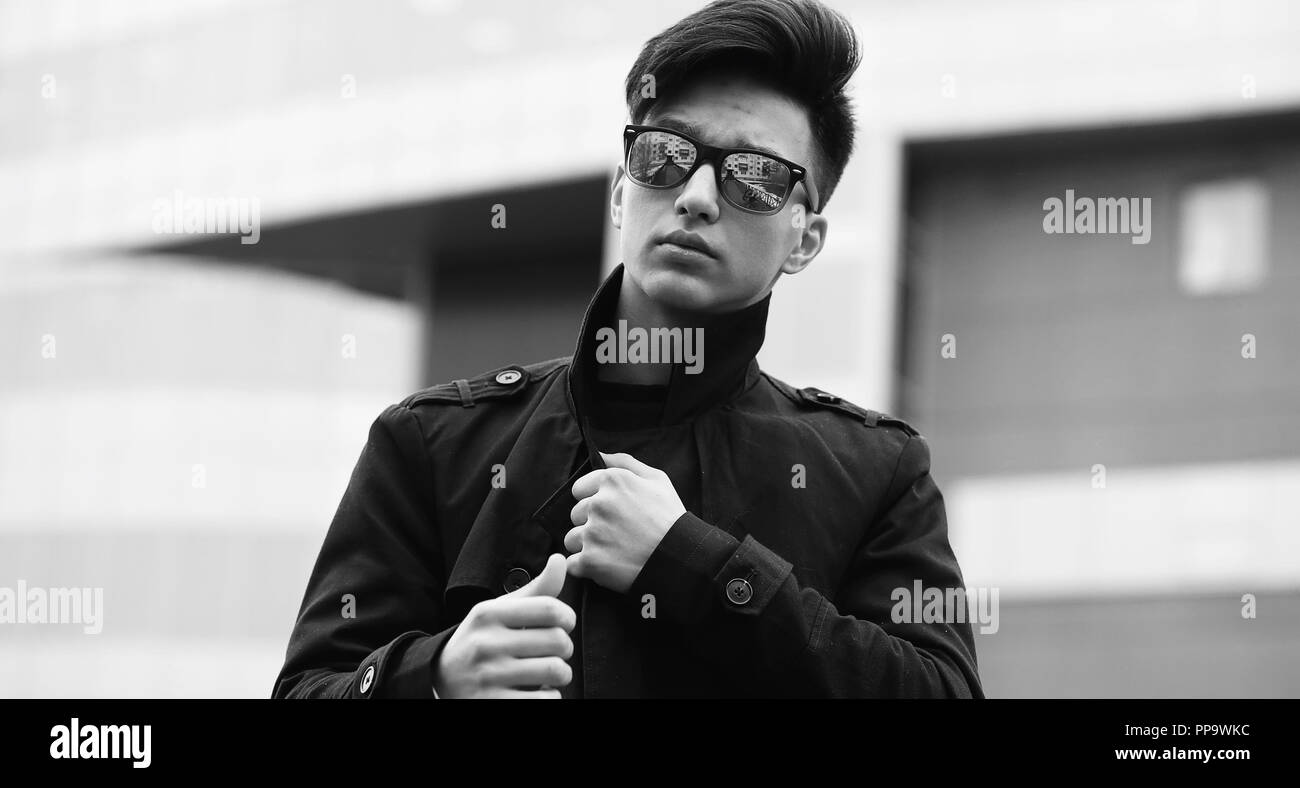 Black White photo of Asian young man outdoors posing Stock Photo - Alamy