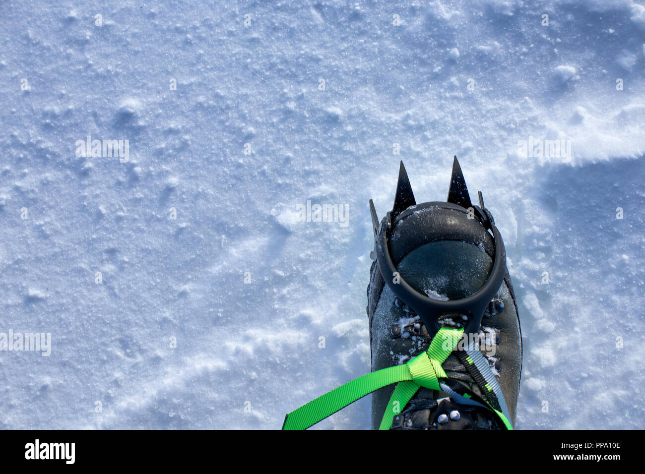 snow crampons - equipment for extreme excursions to the mountains Stock Photo