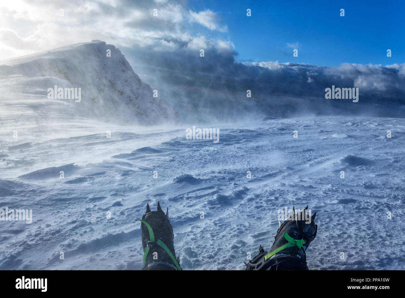 snow crampons - equipment for extreme excursions to the mountains Stock Photo