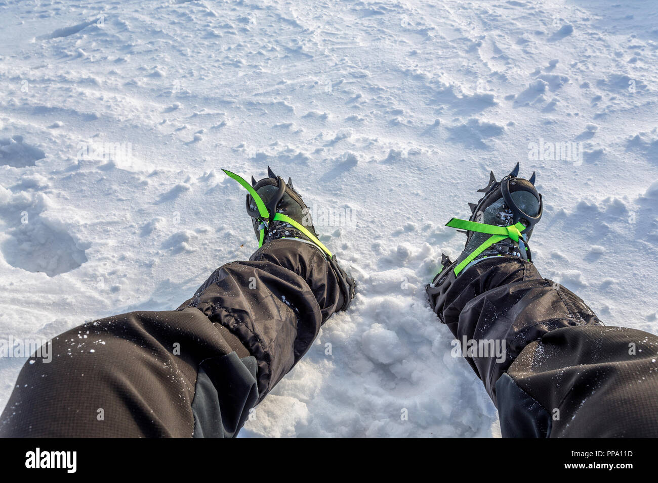 snow crampons - equipment for extreme excursions to the mountains Stock Photo