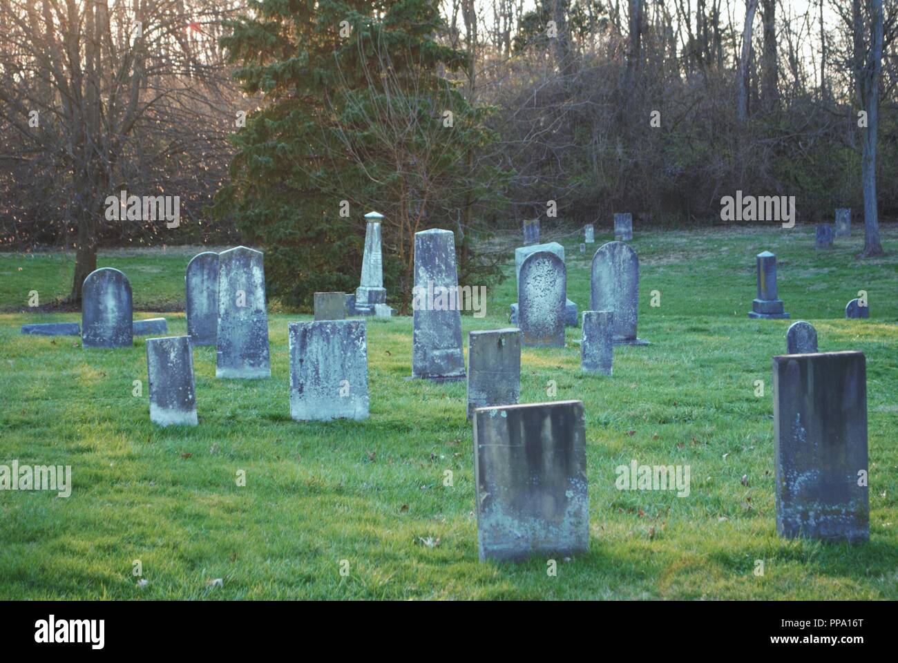 very old broken statue / headstone in a cemetery Stock Photo - Alamy