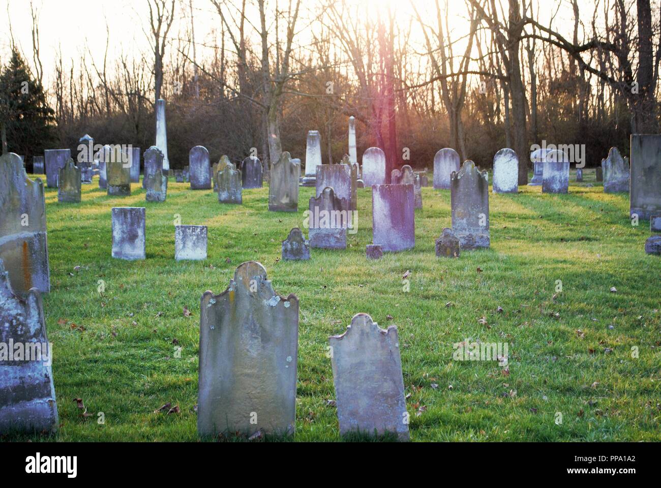 very old broken statue / headstone in a cemetery Stock Photo