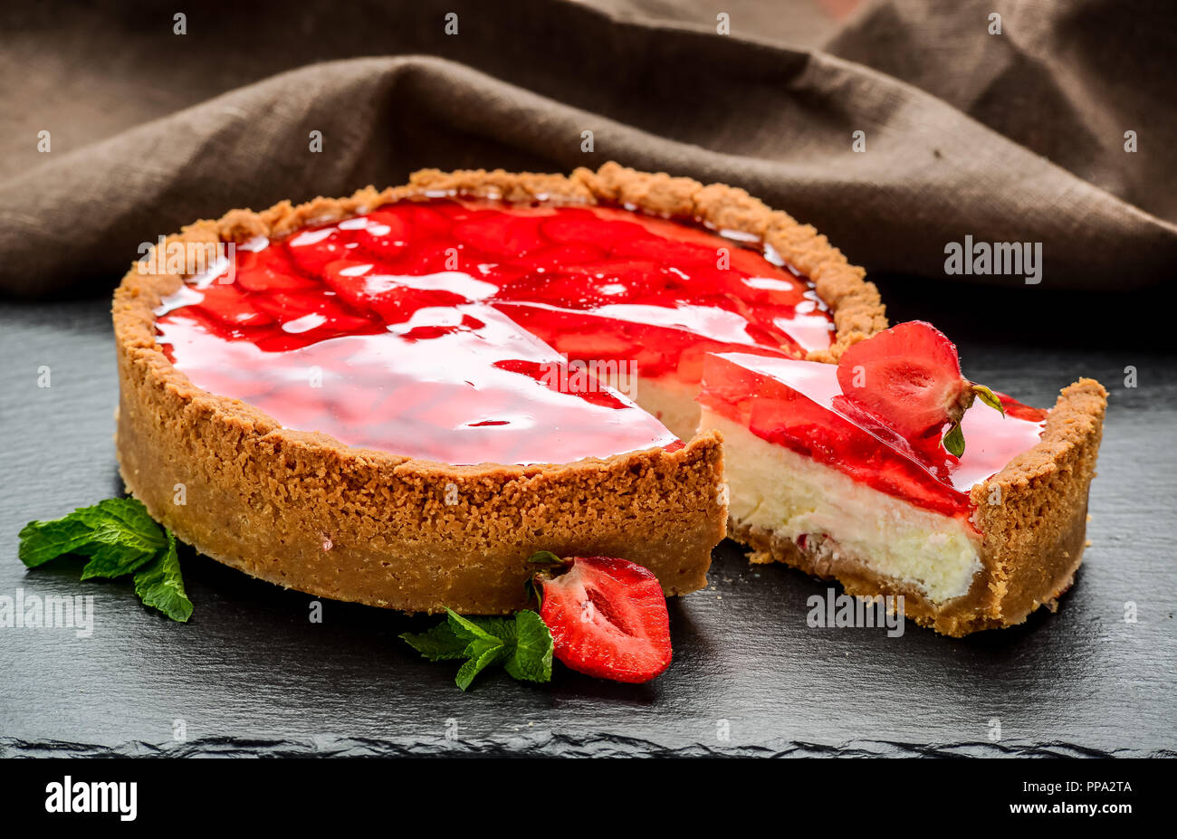 Cold cheesecake with strawberry and strawberry jelly. Stock Photo