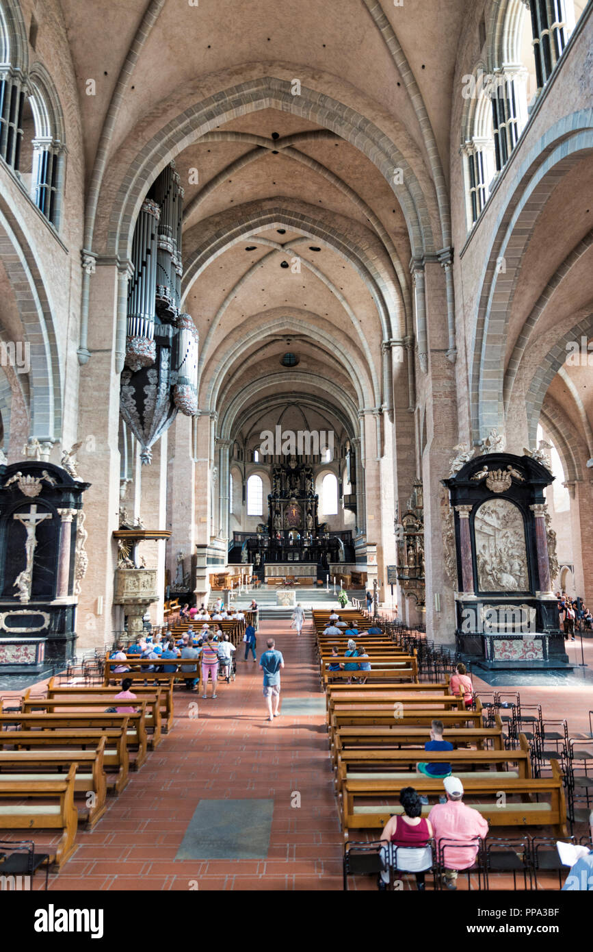 Trier,Germnay,17 aug 2018 people pray and visit the saint peters dom cathedral in the german city of trier, the dom is from the middel ages and a landmark ion the city Stock Photo