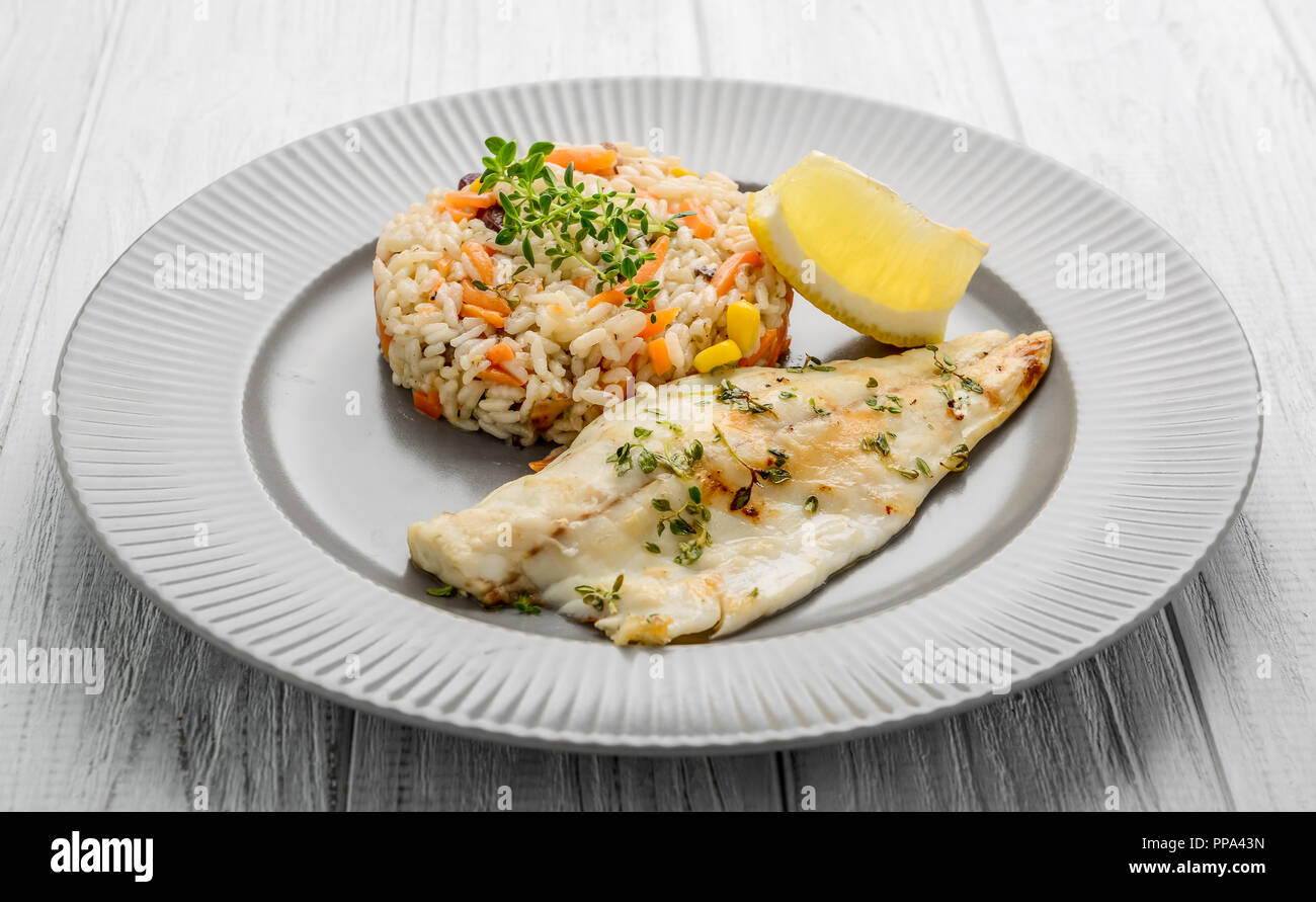 Catfish Fillet with Plum Sauce, Jasimine rice and vegetables. Stock Photo