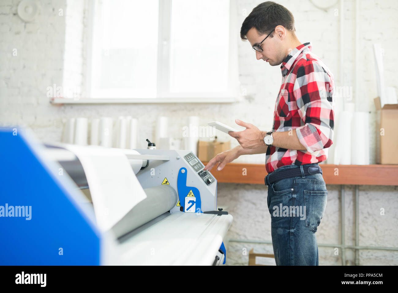 Man working in printing office Stock Photo