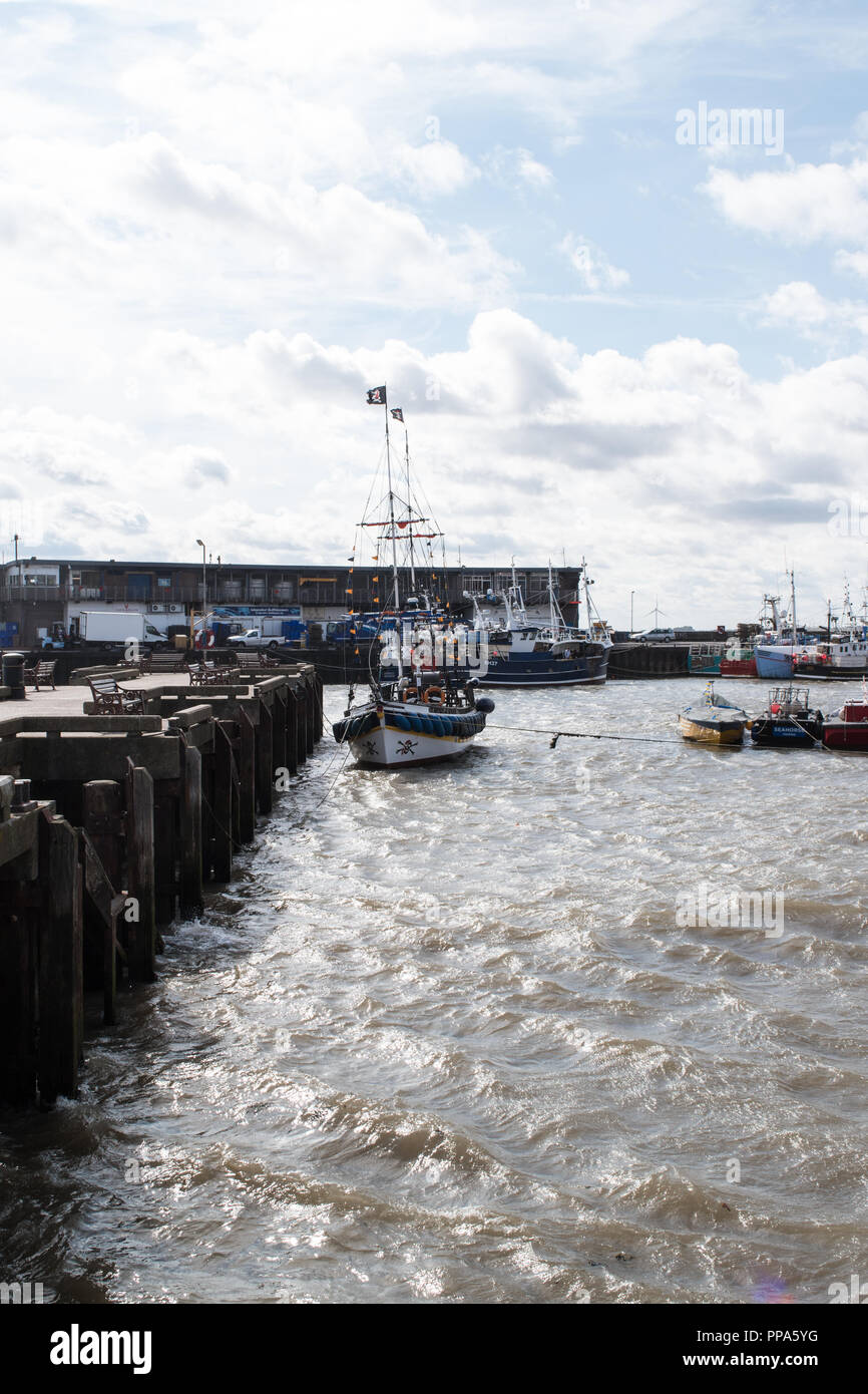 The Pirate Ship Tourist attraction moored up in the harbour due to the choppy seas and UK weather conditions in September 2018 Stock Photo