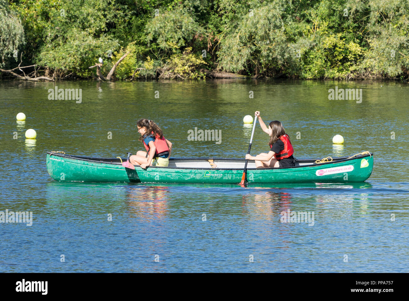 Two young girls in a canoe Stock Photo Alamy