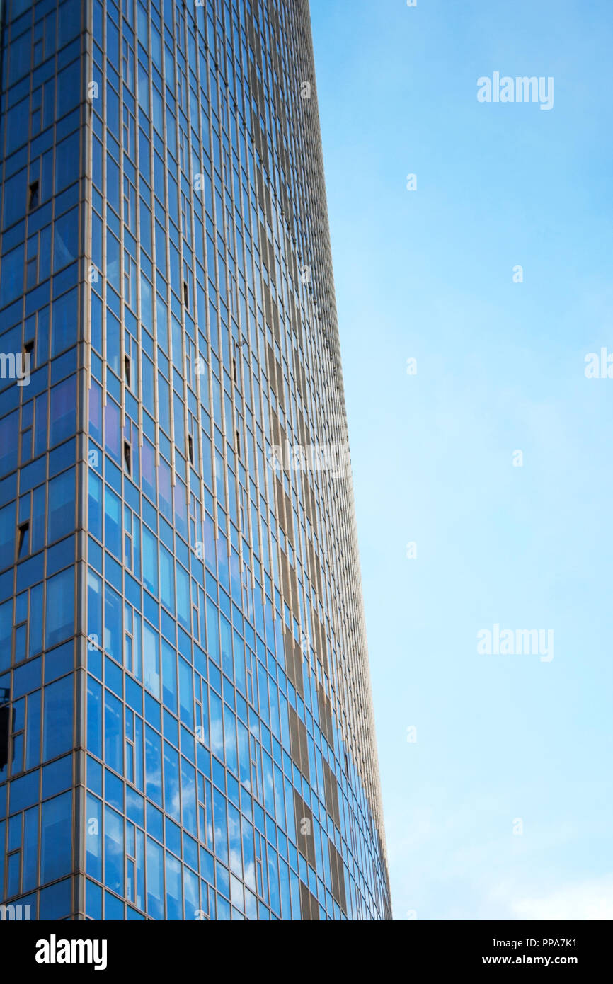 Modern skyscraper glass facade against blue morning sky Stock Photo - Alamy