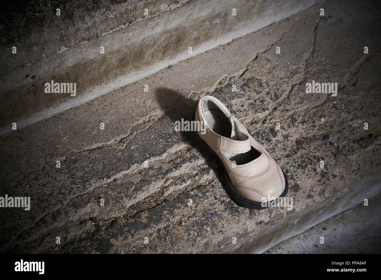 Abandoned Baby Shoe Lying On Old Concrete Floor Lost Children S Shoes Stock Photo Alamy