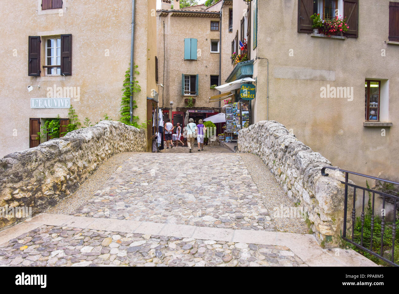 stone bridge of the village Moustiers-Sainte-Marie, Provence, France, houses at stone bridge, member of most beautiful villages of France Stock Photo