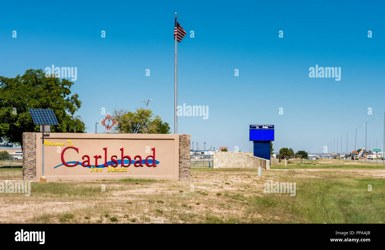 Welcome to the city of Carlsbad sign and city street, road in Carlsbad New Mexico, USA Stock Photo