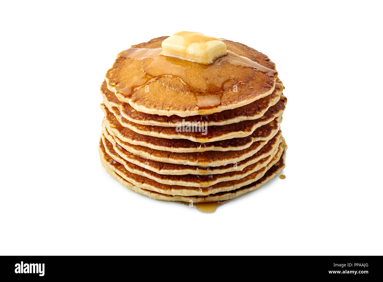 Stack of pancakes with butter and maple syrup on white Stock Photo