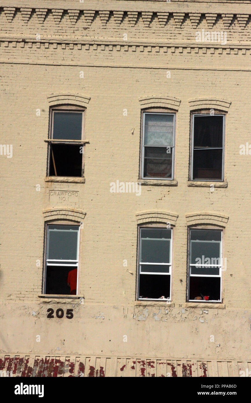 Open windows on old brick building in downtown Harrisonburg, VA, USA