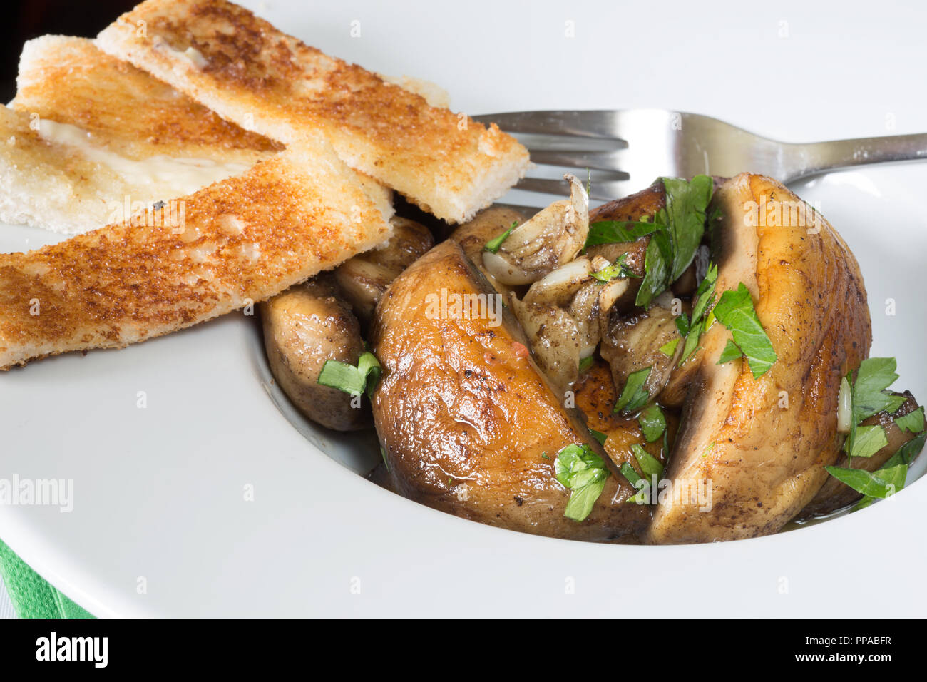 An English pub/restaurant Entree dish of fried Garlic Mushrooms with