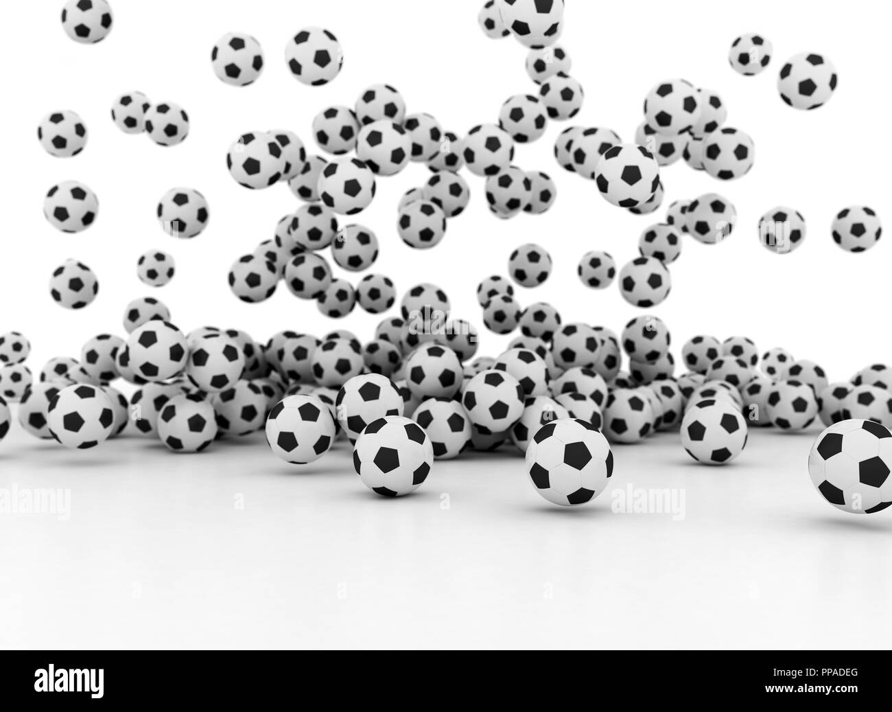 Many soccer balls falling on white background Stock Photo