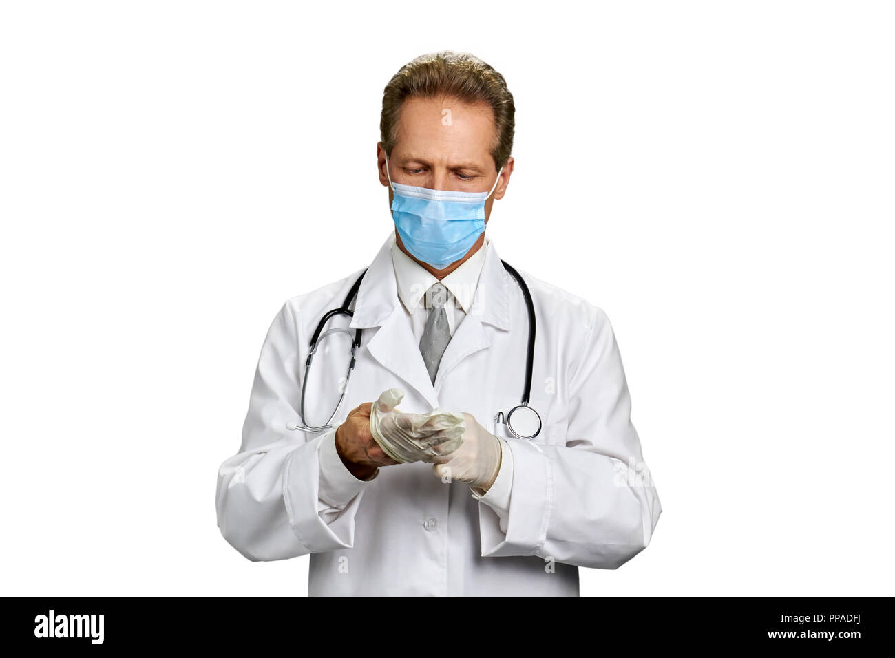 Male doctor putting on gloves Stock Photo Alamy