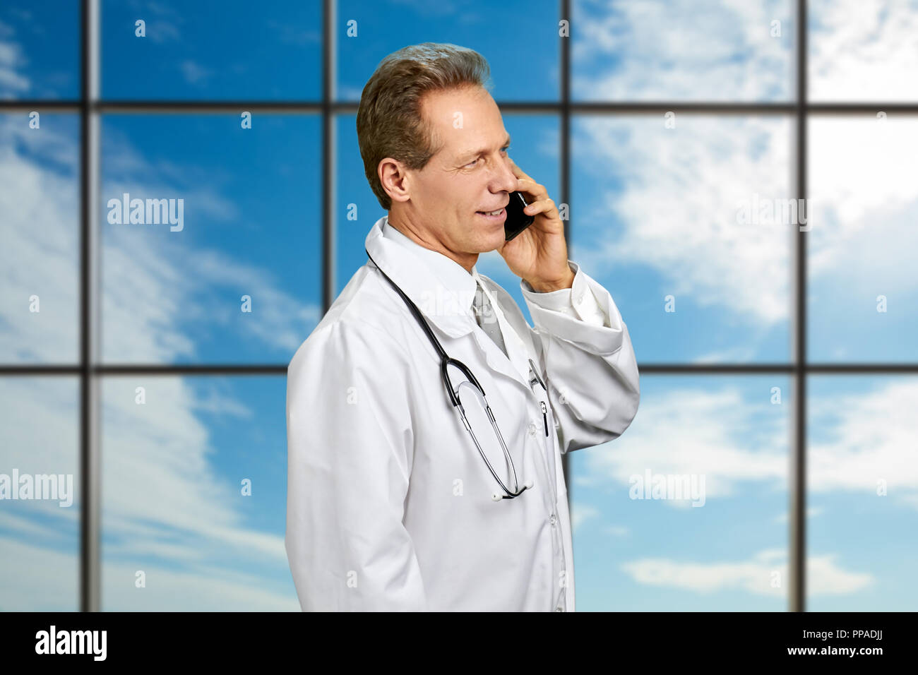 Portrait talking middle aged doctor hi-res stock photography and images ...