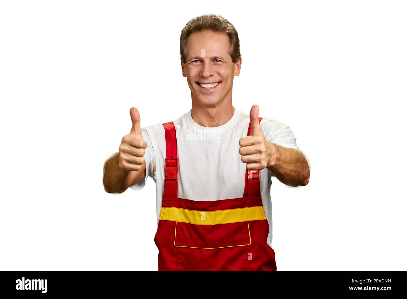 Cheerful smiling engineer showing thumbs up Stock Photo - Alamy