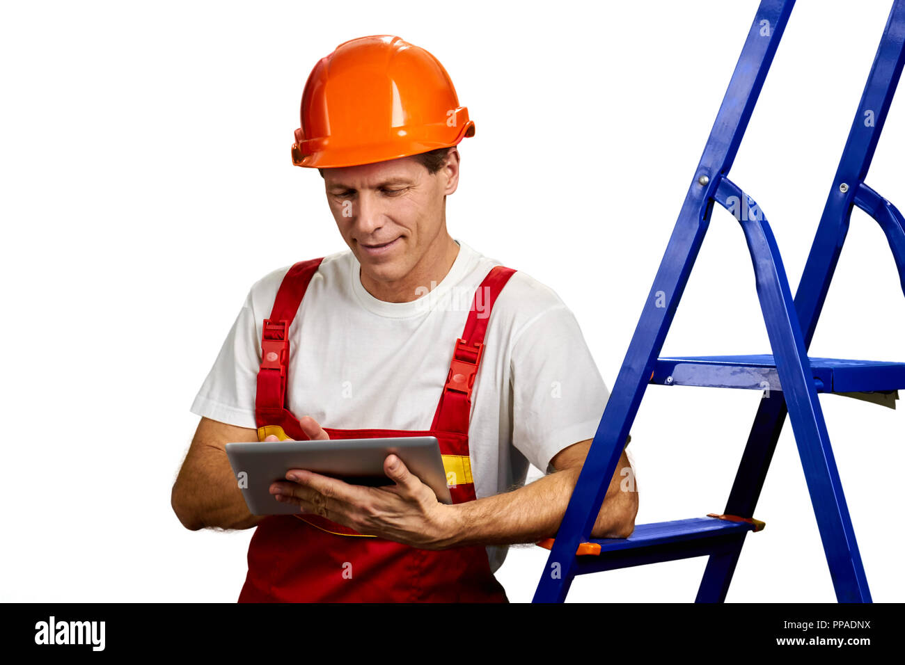 Handsome foreman using digital tablet. Stock Photo