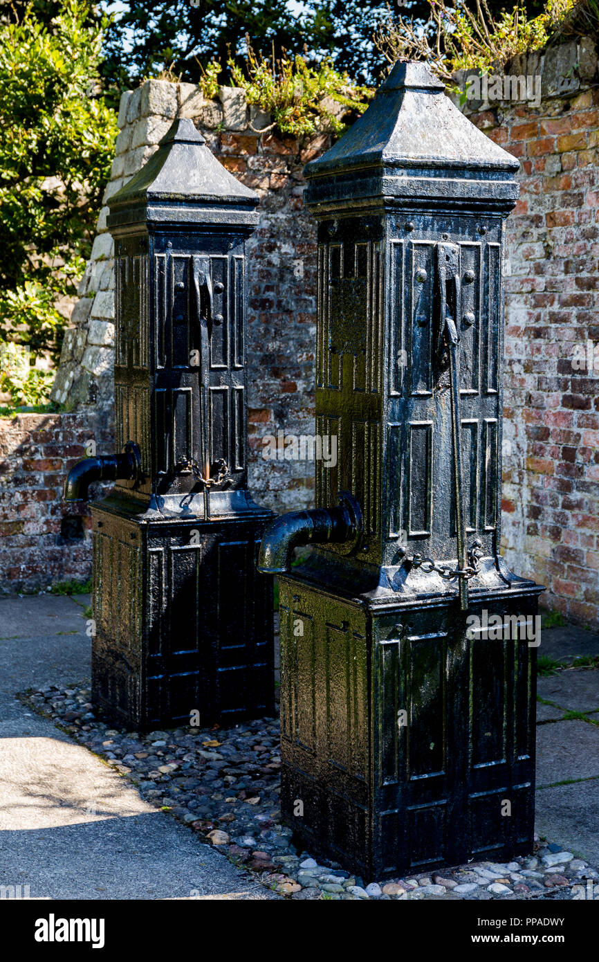 Two Victorian water hand pumps,  Beaumaris castle Anglesey Wales Stock Photo