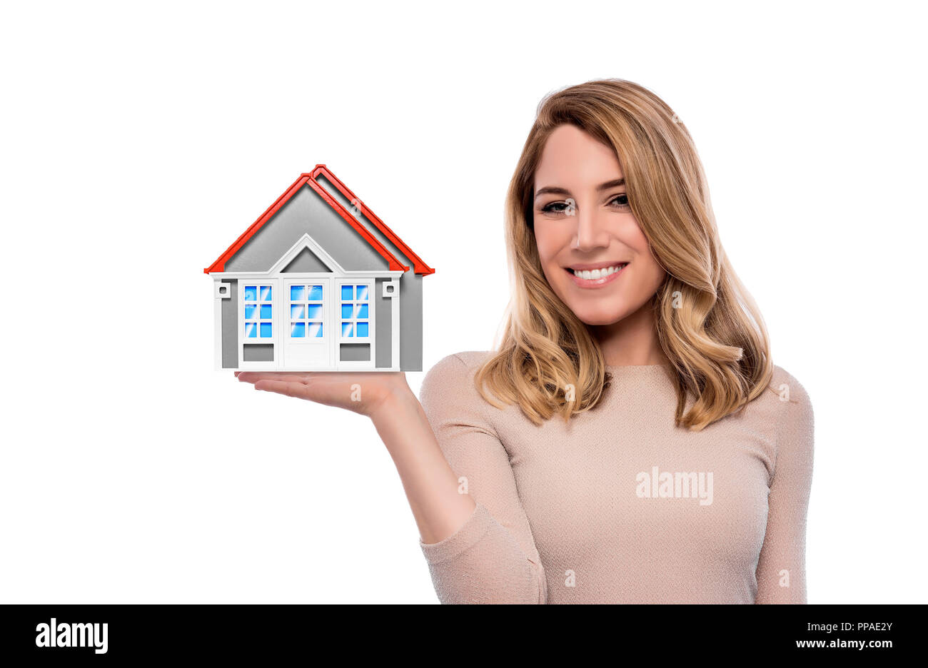 Woman holding model of a house. Isolated on white Stock Photo - Alamy