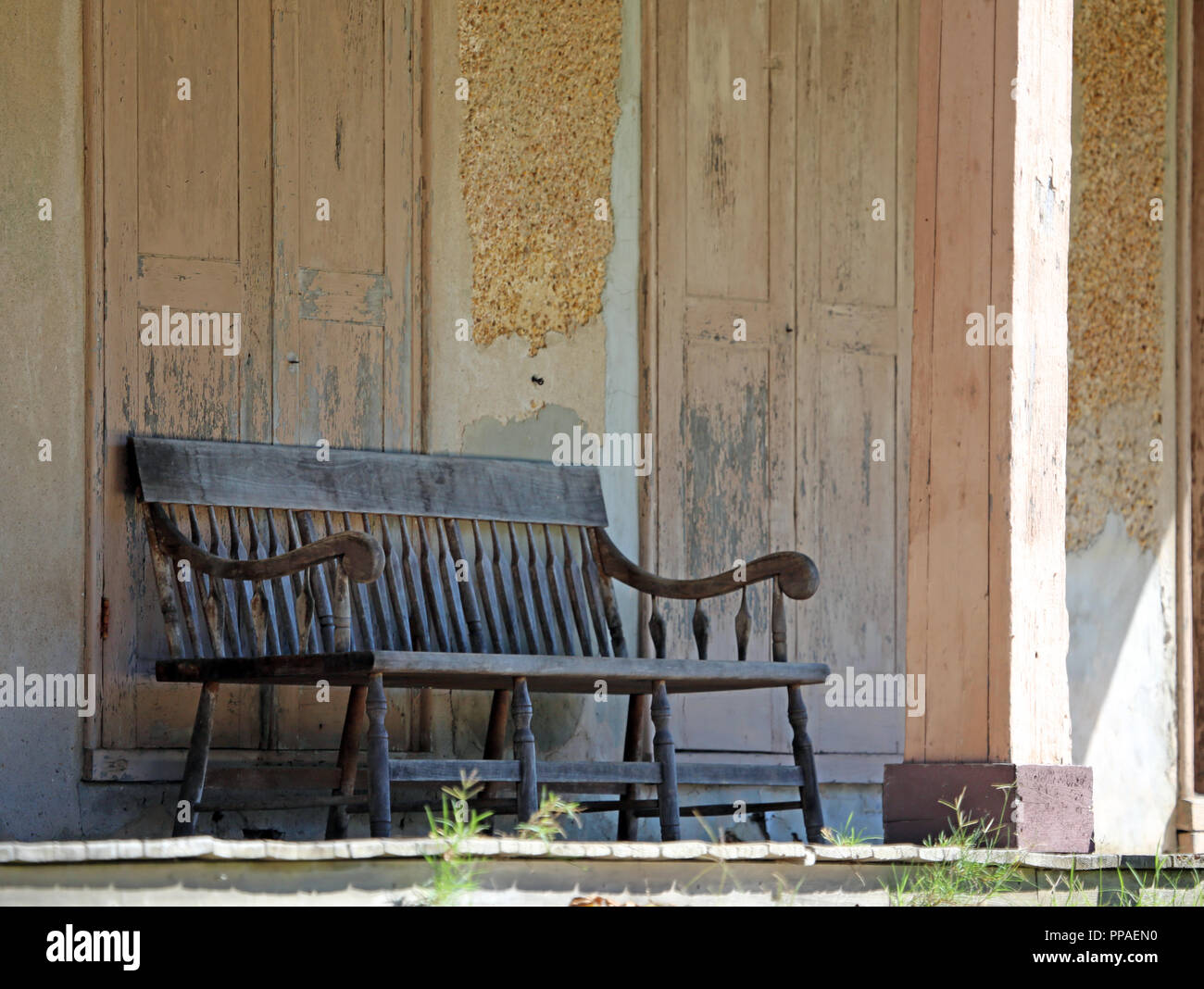 old wooden bench on porch of historic village store Stock Photo - Alamy