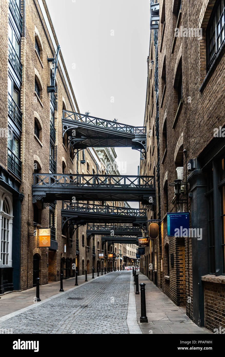 The street Shad Thames and the connecting bridges, Southwark, London, England, UK. Stock Photo