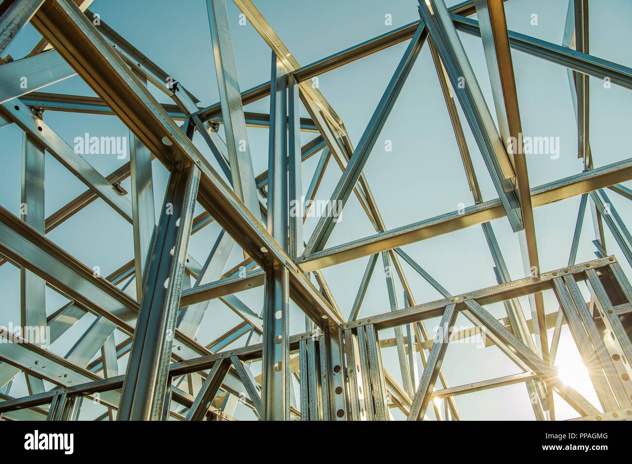 Building Steel Skeleton Frame at Sunset. Modern Building Structure Technologies. Stock Photo