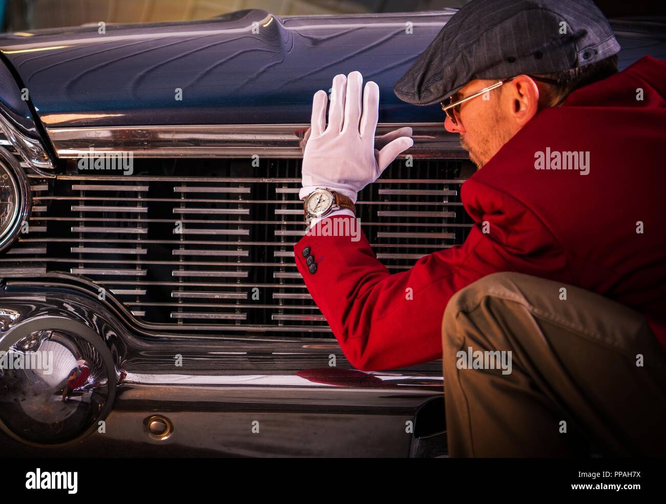 Vintage Car Evaluation by Caucasian Automotive Specialist. Stock Photo