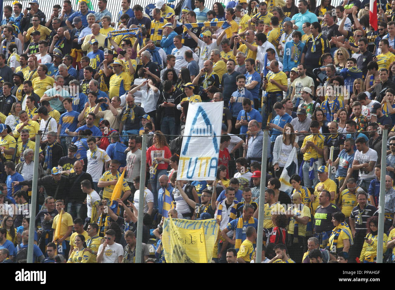 Frosinone / Italy - May 16, 2015: Canary fans at the stadium in the match that will promote the team in Serie A Stock Photo