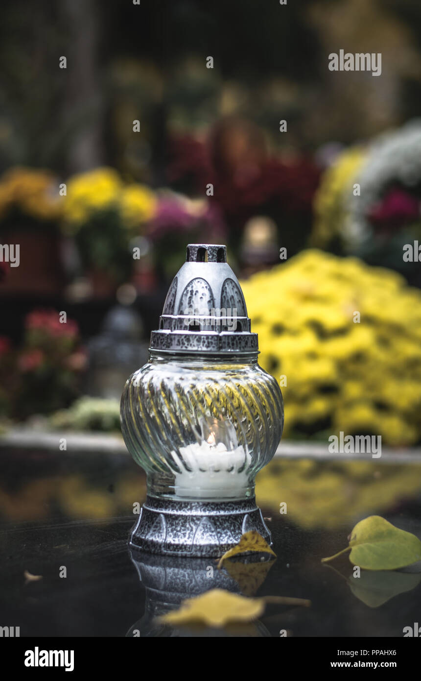 candle decoration in the cemetery at All Saints Day in autumn time
