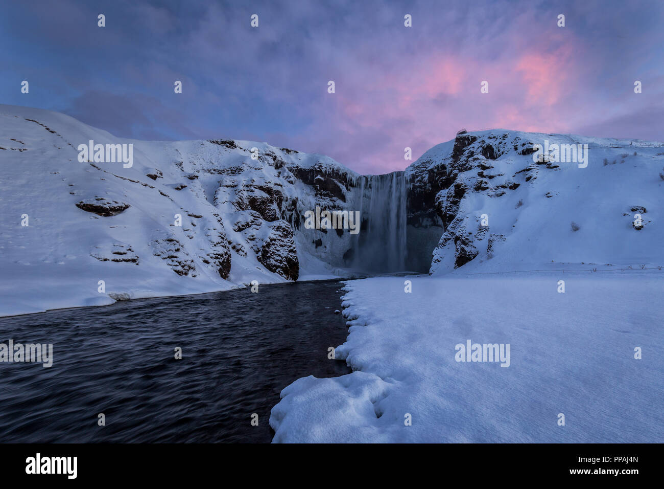 Skogafoss waterfall alone in a cold winter day Stock Photo
