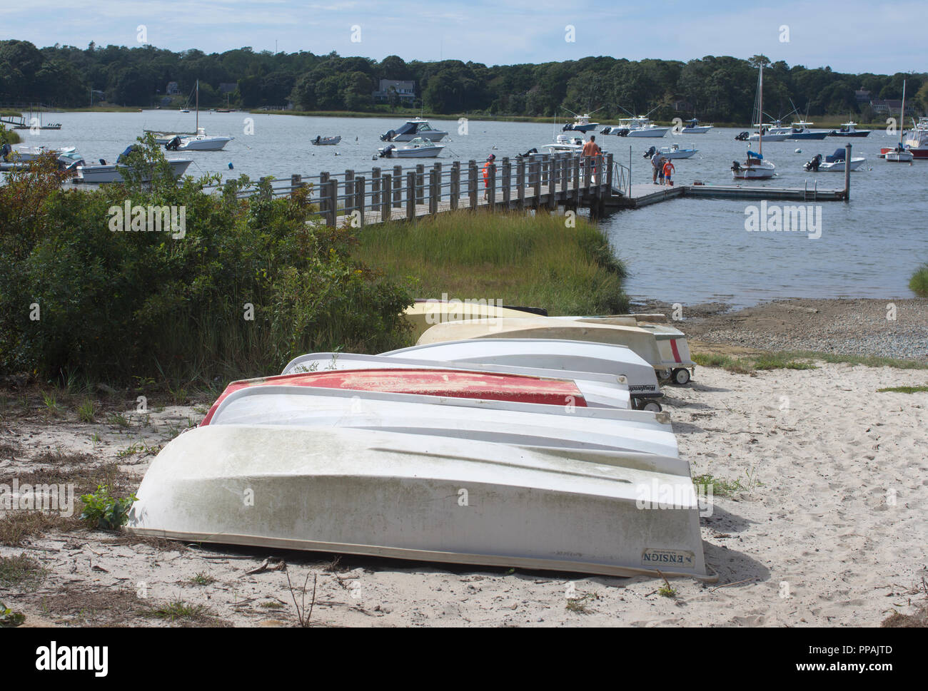 Dingies at the wait in East Orleans, Massachusetts on Cape Cod, USA Stock Photo