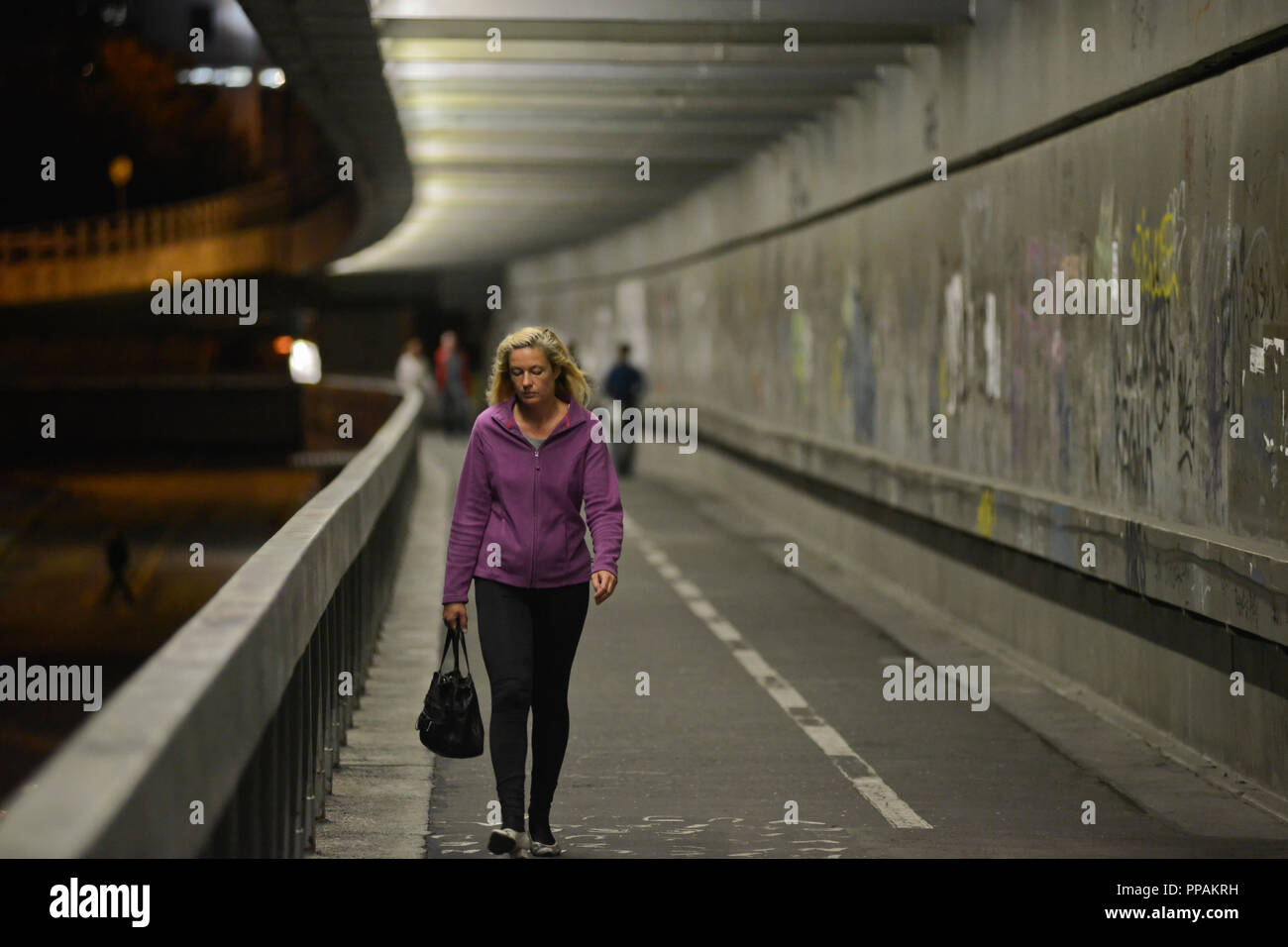 Young girl walking alone, Most SNP, Bratislava, Slovakia Stock Photo