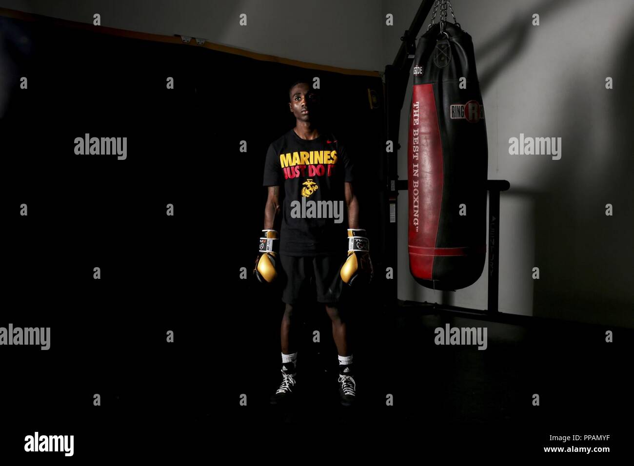 Cpl. Oubigee Jones stands in the gym where he trains nearly every day aboard Marine Corps Air Station Beaufort, Aug. 30. Jones began fighting when he was eight years old. “I grew up in the streets of south Dallas, the hood basically. Everyone started fighting at a young age, whether it be to defend themselves or to earn their stripes.” Jones is an administrative specialist with Headquarters and Headquarters Squadron. Stock Photo