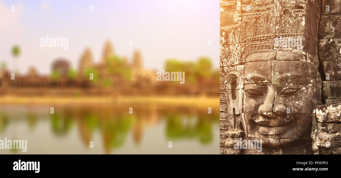 Giant stone face in Prasat Bayon Temple on blurred background. Famous  landmark Angkor Wat complex, khmer culture, Siem Reap, Cambodia Stock Photo  - Alamy
