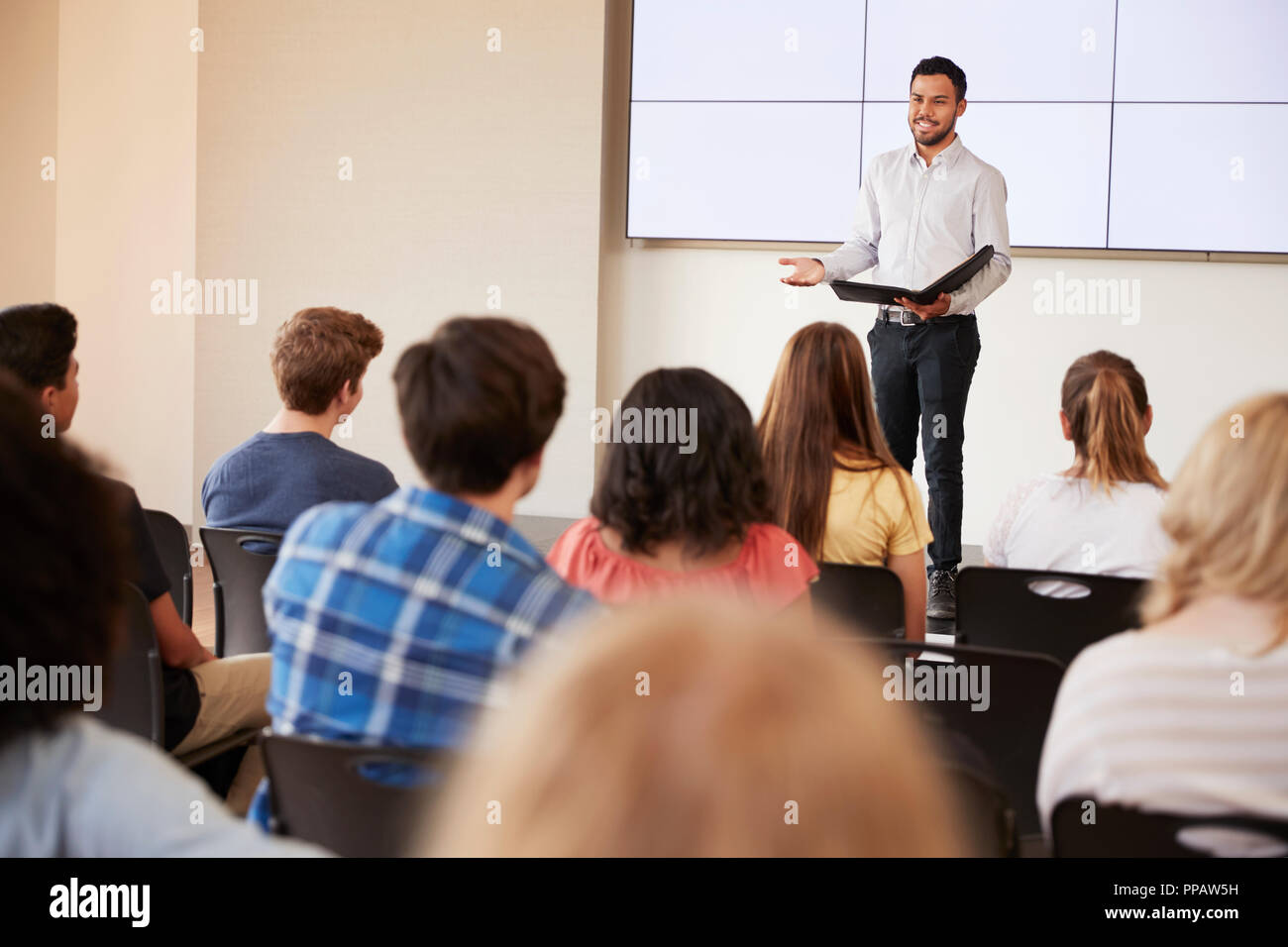 giving a speech to high school students