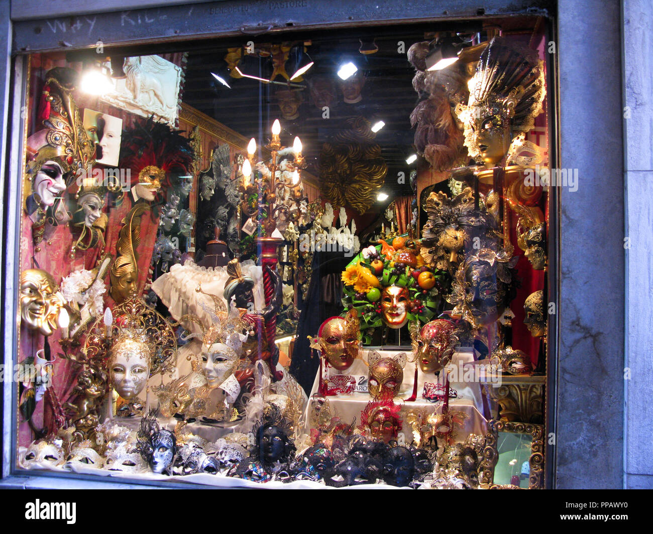 VENETIAN MASKS in shop window in Venice Stock Photo