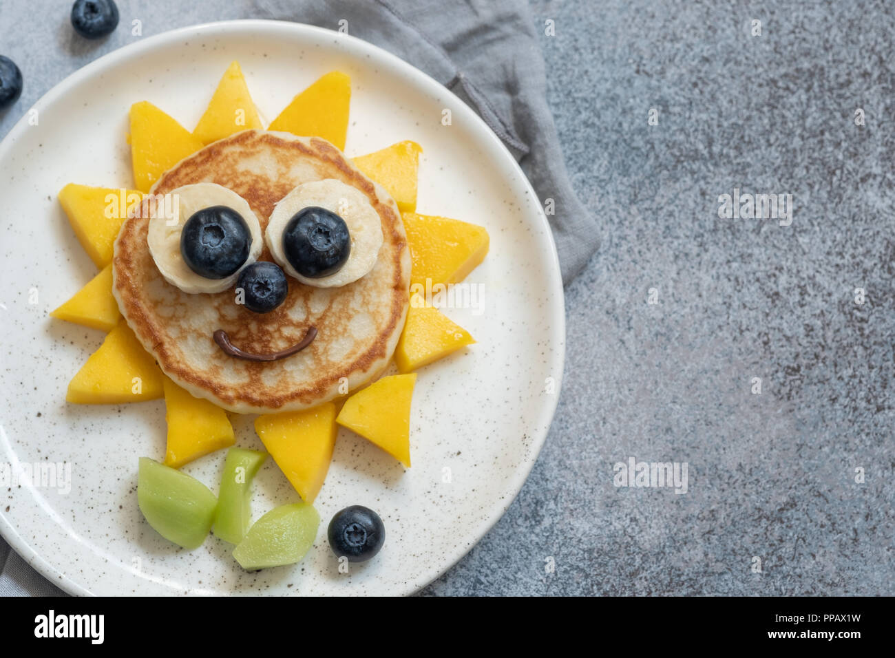 Funny Flower Pancake with berries for kids Stock Photo