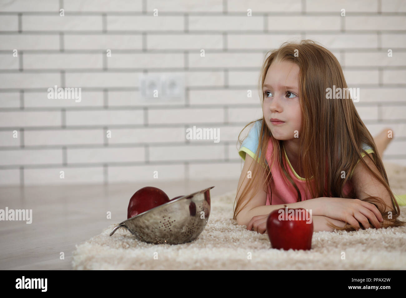 little girl lies on the floor Stock Photo - Alamy